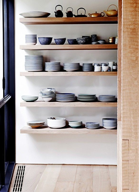 Ombre dishes on shelf in kitchen