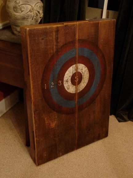 Vintage dart board cabinet on left wall after sofa...