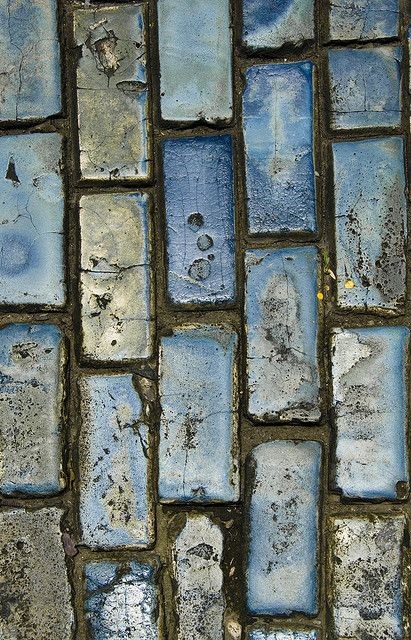Blue cobblestones lead the way in Old San Juan. Do...
