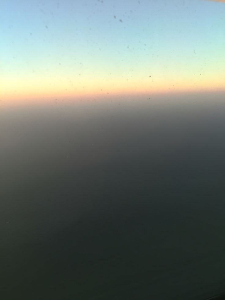 Flying over the Italy on a foggy morning