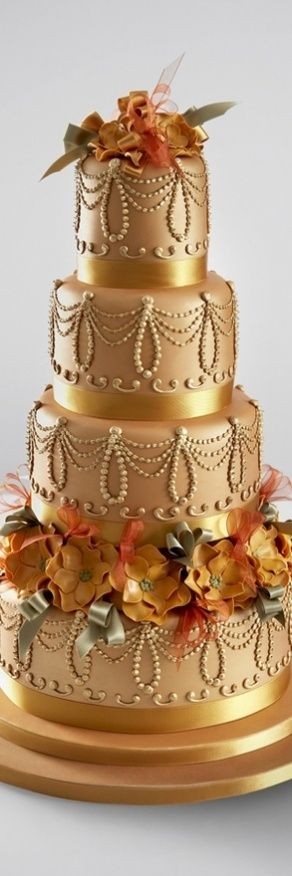 Vintage Gold wedding cake decorated with sugar flo...