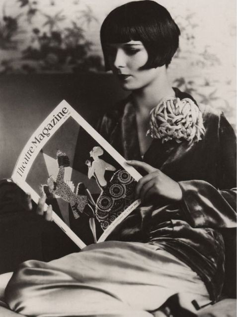 More Louise Brooks, this time with a book. Someone...