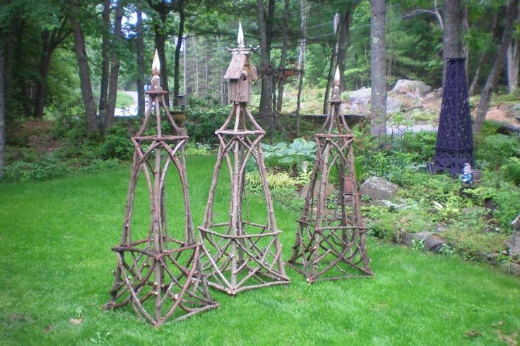 garden obelisks made from branches and twigs with...