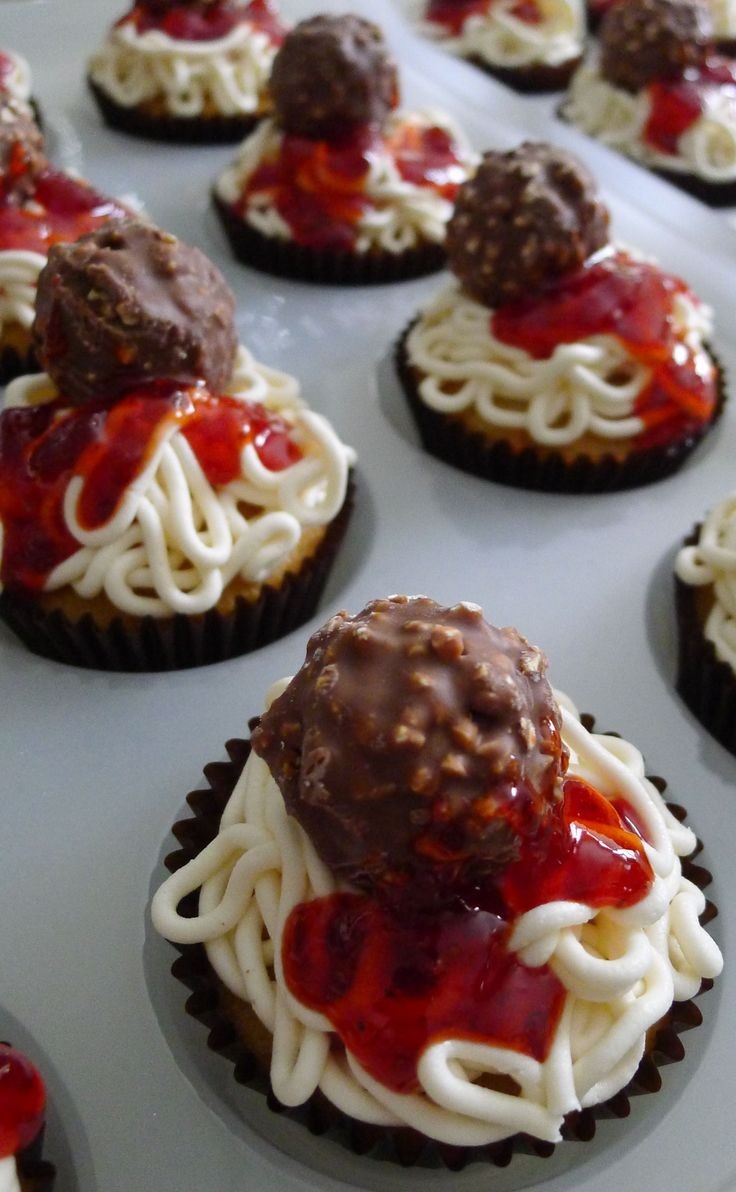 Cupcakes made to look like spaghetti.  White frost...