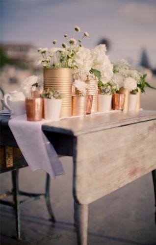 paint tin cans with "copper" paint and use as vase...