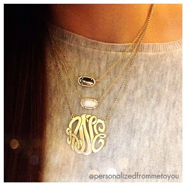 a Monogram Necklace and two Kendra Scott necklaces...