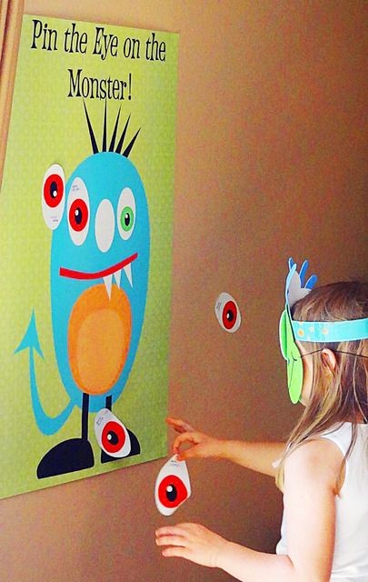 Pin the eye on the monster party game with monster...
