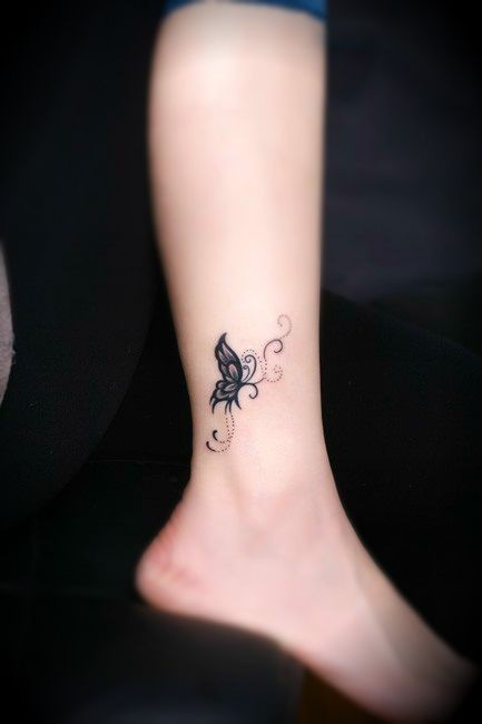 black #butterfly #tattoo on the leg