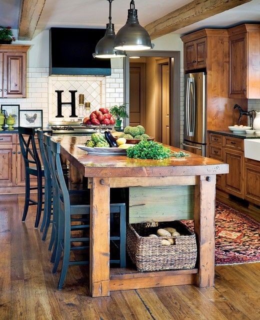 Love this farm style kitchen island which doubles...