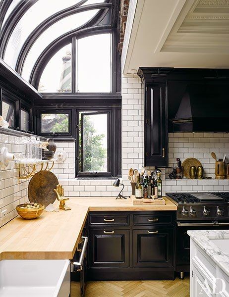 A solarium-style window fills the kitchen with nat...
