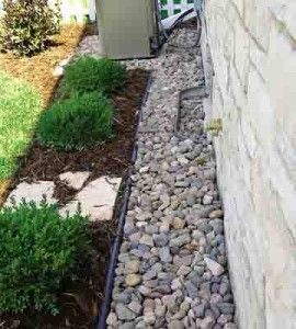 So doing this...a rock maintenance strip for aroun...