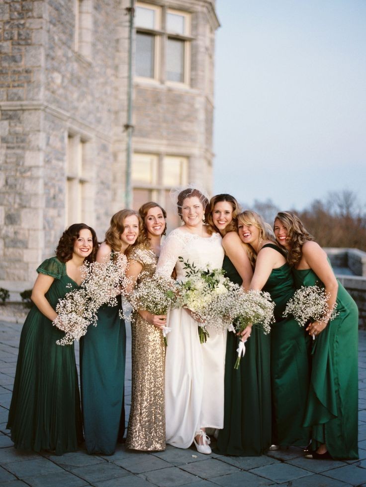 Emerald and gold bridesmaids | Photography: Megan...