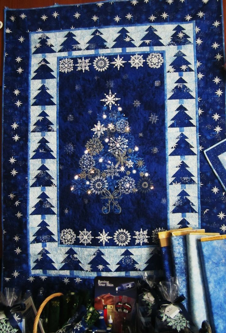 Northcott's Christmas Night lighted quilt seen at...