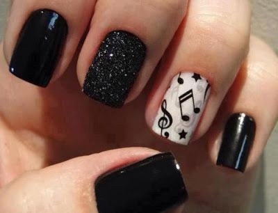 Black nails with music notes on the accent finger....