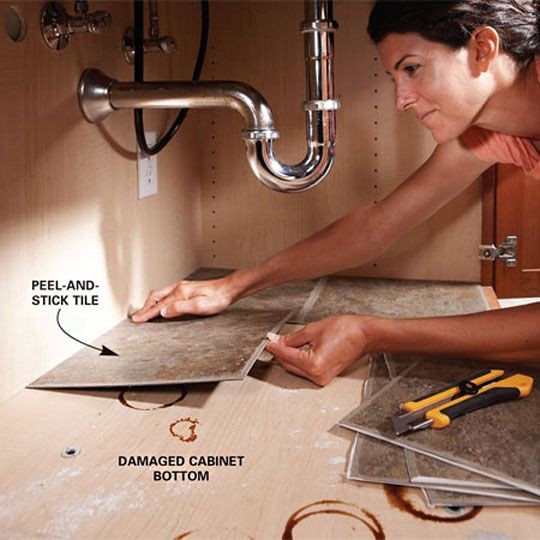 line your cabinet under the kitchen sink with peel...
