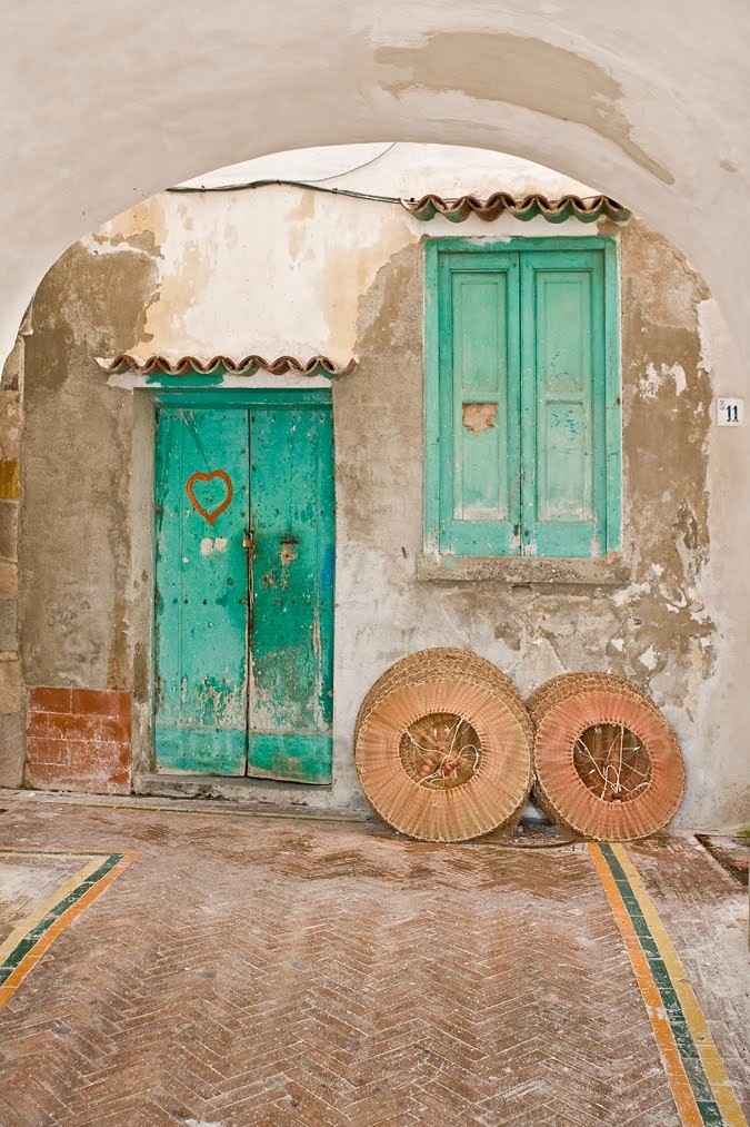 a blue door and window in Cetara, a small town alo...