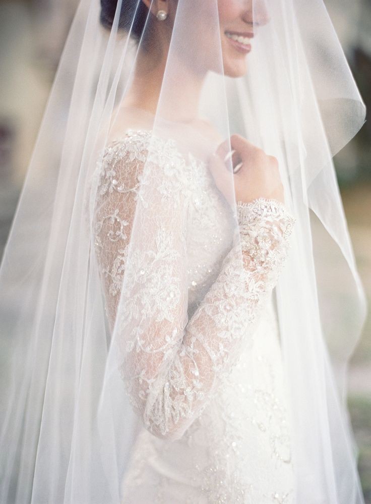 Mira Zwillinger long sleeve wedding dress. Photogr...