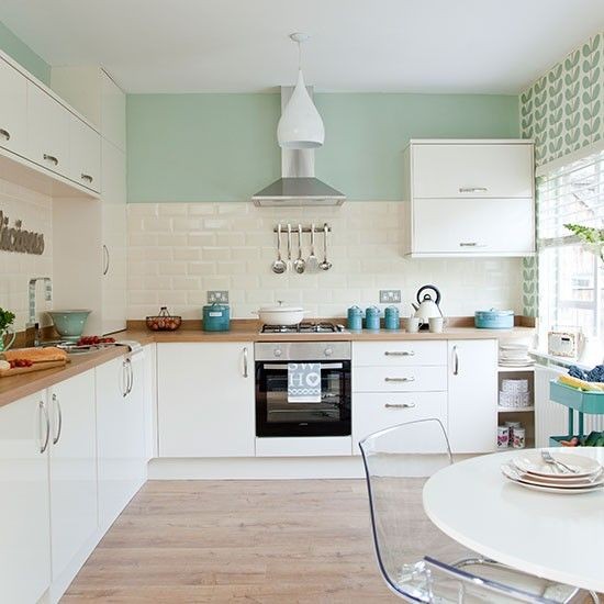 Traditional kitchen with pastel green walls | Kitc...