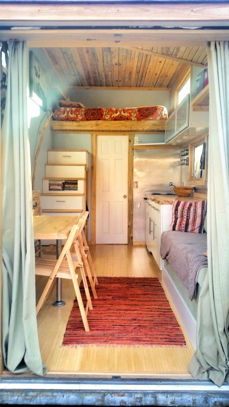 A 159 square feet tiny house on wheels clad in var...