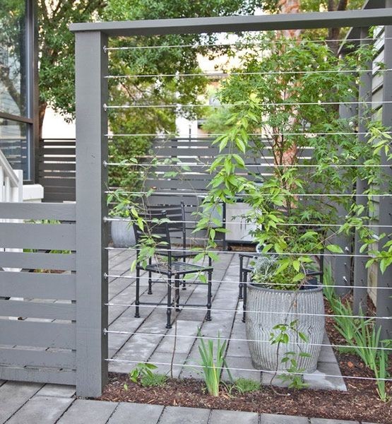 Cable wires mounted between fence posts create a s...