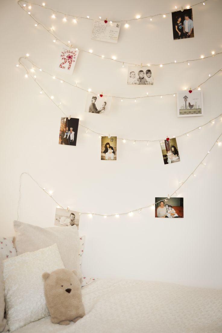 Use warm white fairy lights and picture hooks to c...