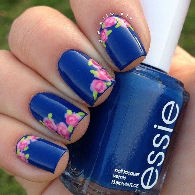 Essie nail polish in navy paired with floral nail...