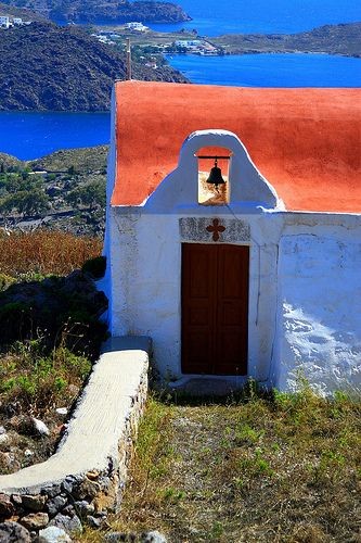 Red-roofed church overlooking Skala Bay. Patmos is...