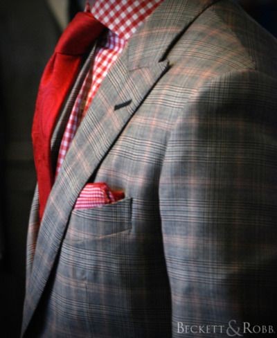 Red paisley tie matched with red gingham shirt giv...