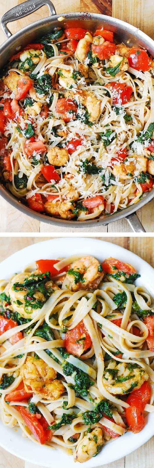 Shrimp pasta with fresh tomatoes and spinach in a...