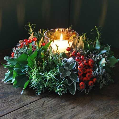 Christmas candle piece made from berried and folia...