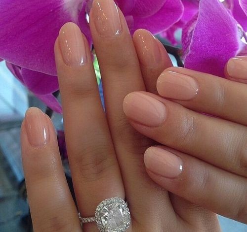 Cute nude pink on rounded natural nails.