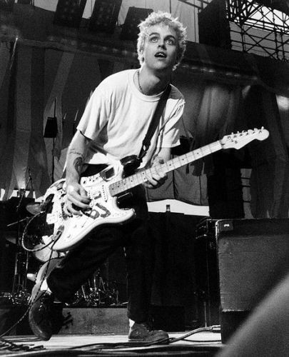Green Day's Billie Joe Armstrong playing guitar on...