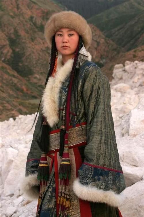 Kirghiz woman in traditional costume; Kyrgyzstan,...