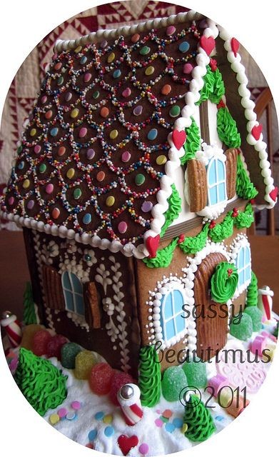 Check out her pretty gingerbread/sugar cookie hous...