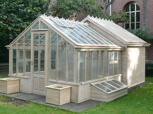 Greenhouse with a tool storage shed or chicken coo...