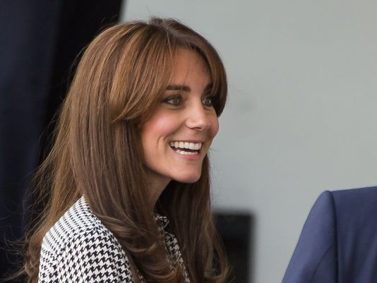 Back at work, Duchess Kate shows off her new bangs