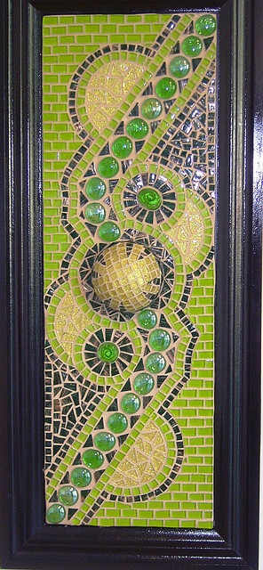 Pretty green abstract design mosaic on a cabinet d...