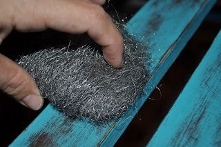 Distressing furniture.  Using fine steel wool help...